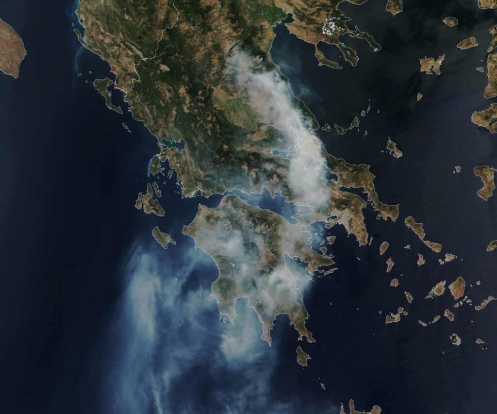 Firefighters battling a large wildfire on the Greek island of Rhodes as flames approach seaside resorts