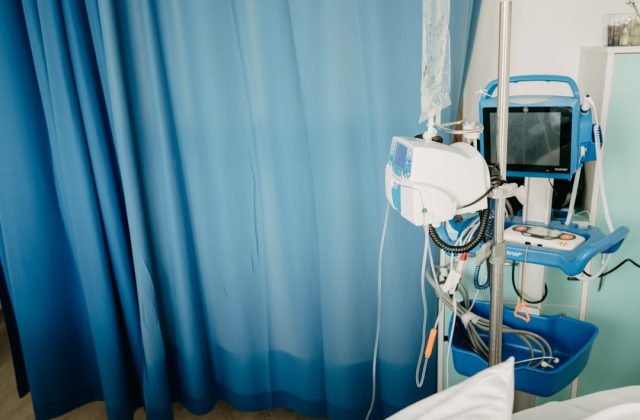 Swiss Brain Implant Restores Natural Walking in Paralyzed Patient A medical team in a Swiss lab adjusts electrodes on a patient's head during a brain implant procedure.
