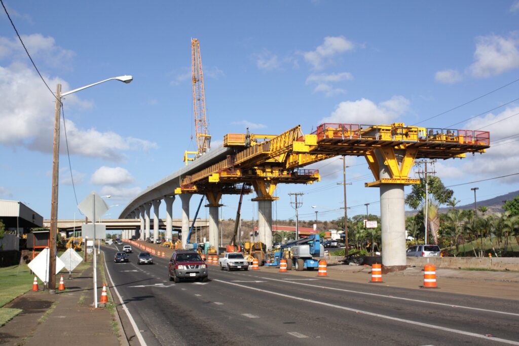 Crumpled launching gantry and concrete segments cover Rama II Road after the Thailand motorway construction collapse.