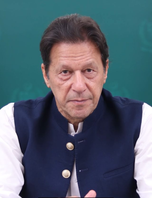 Imprisonment of Imran Khan Police van carrying Imran Khan leaves Islamabad court as PTI supporters shout slogans and wave party flags.