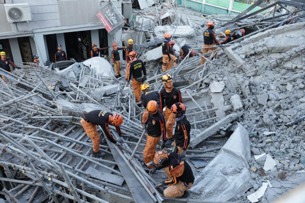 Rescuers race against time in dangerous search after Philippines quake