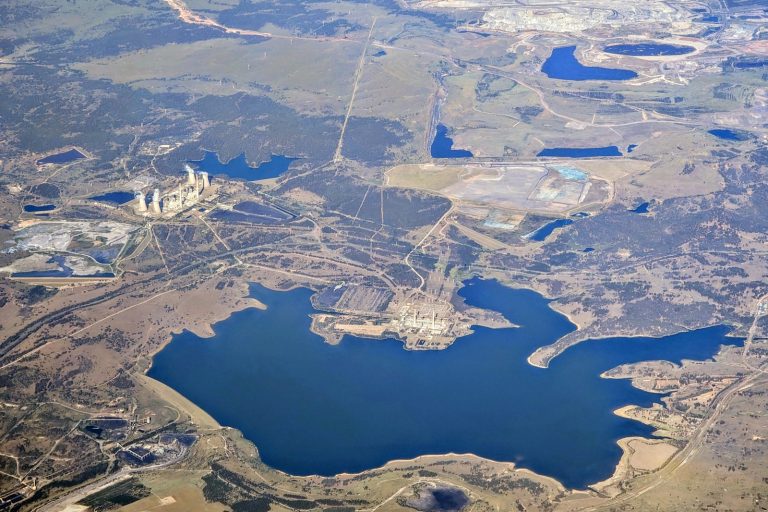 AGL Demolishes Twin Chimney Stacks at Closed Liddell Coal Plant in NSW