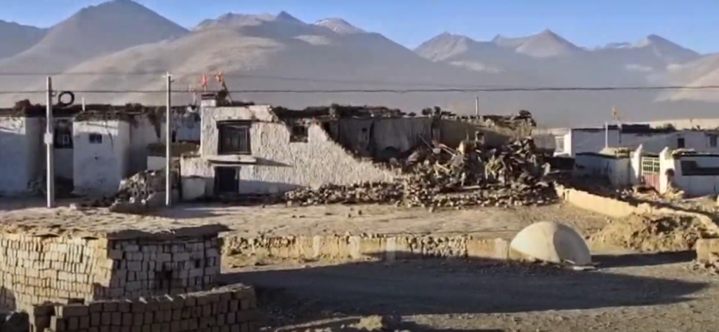 Rescuers search through rubble of collapsed buildings in Tingri County after a powerful earthquake struck Tibet.