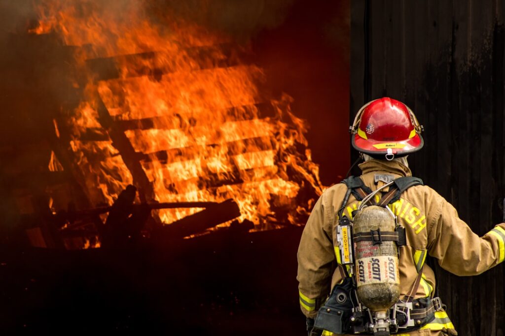 Firefighters and emergency responders work at the scene of a commercial building fire in Xinyu, Jiangxi.