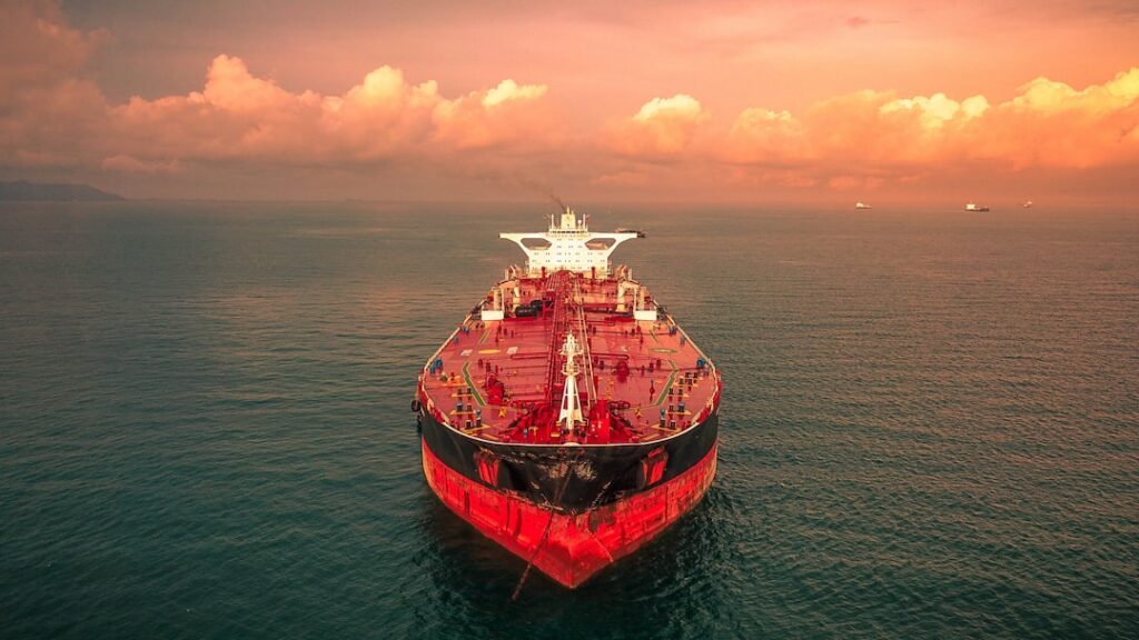 Philippine Coast Guard vessel approaches the sunken MTKR Jason Bradley in Manila Bay to seal leaking diesel cargo tanks.