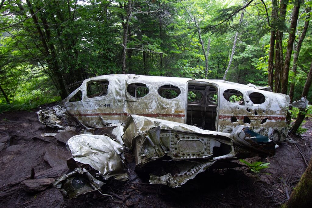 Rescue teams walk the rugged crash site where a white SATENA Beechcraft 1900 lies broken near Cúcuta