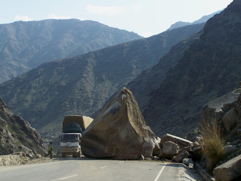 Emergency crews block the Égratz Viaduct after boulders crashed onto the roadway, leaving two dead and two injured.