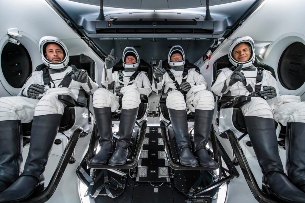 SpaceX rocket launches from Cape Canaveral carrying three paying customers and an astronaut escort to the International Space Station.