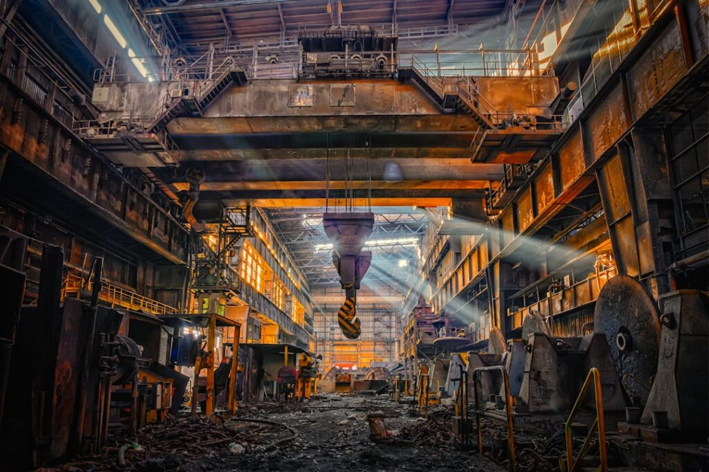 Investigators examine damaged steel mill equipment after a deadly explosion killed four workers in Yingkou, Liaoning.