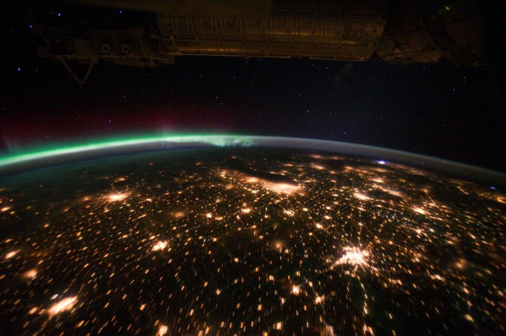 Artificial Satellite Illuminating Earth From Space
