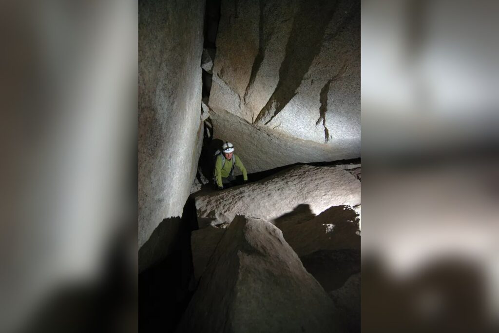 Explorer In A Cave